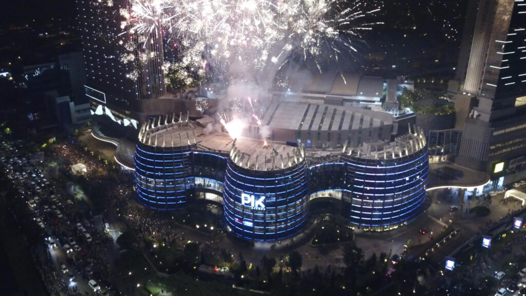 Fireworks over PIK Avenue building at night