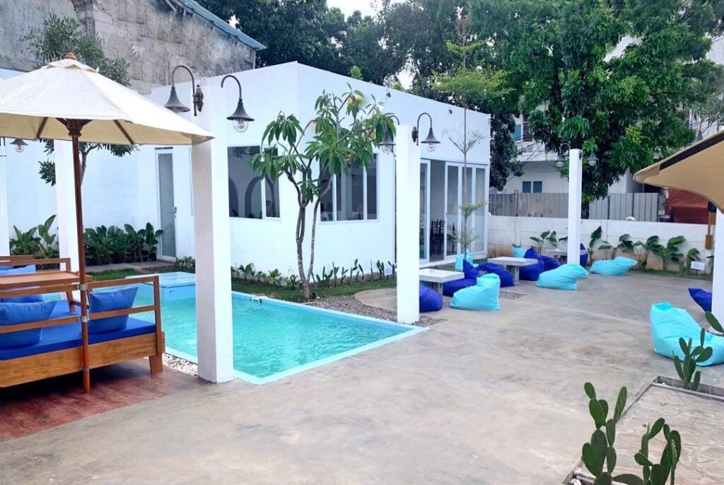 Bear Sama Cafe outdoor lounge with pool and blue bean bags