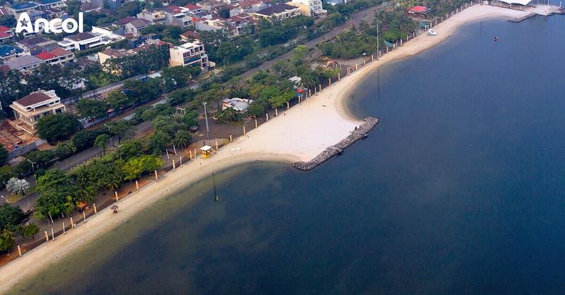 Ancol logo on aerial beach and waterfront skyline