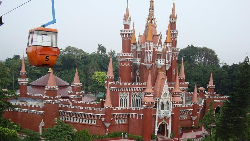 Red brick fairytale castle with orange cable car 5