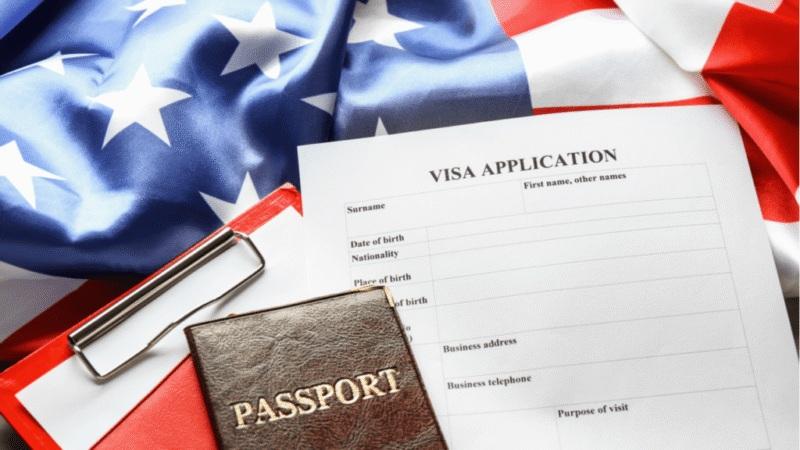 Passport and visa application on American flag