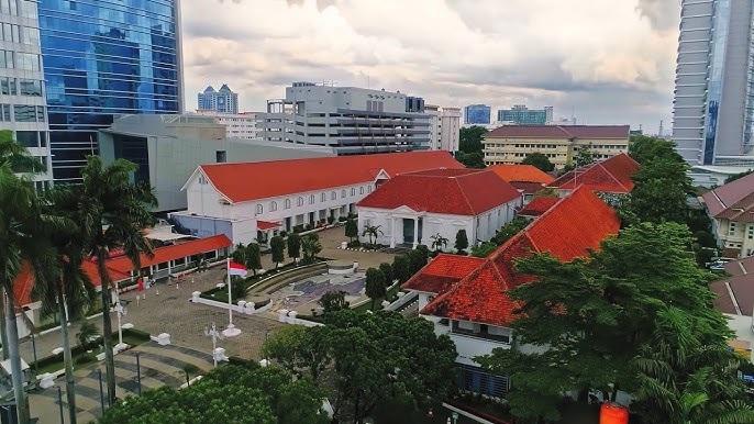 Aerial view of red-tiled roofs and courtyard