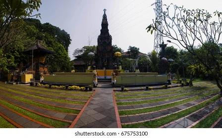 Balinese temple courtyard with tall stone shrine