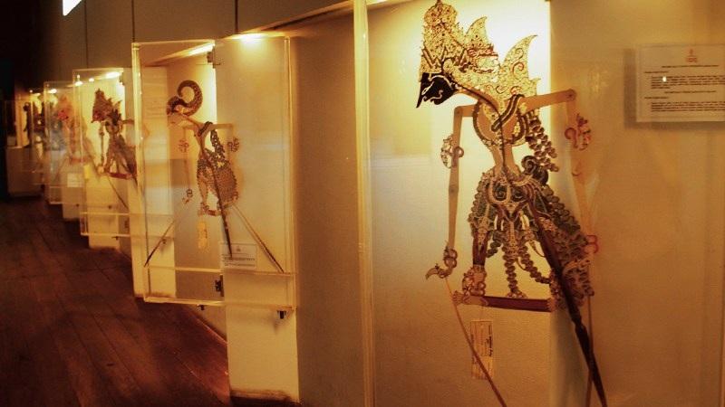 Wayang shadow puppets displayed in museum cases