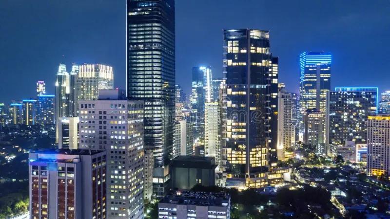 nighttime city skyline with illuminated skyscrapers