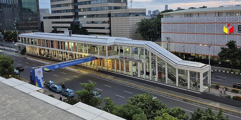 modern BRT station and pedestrian bridge on city avenue