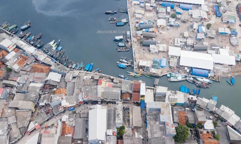 Aerial view of coastal fishing village and boats