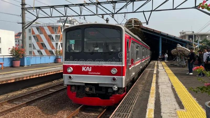 Red KAI commuter train at station platform
