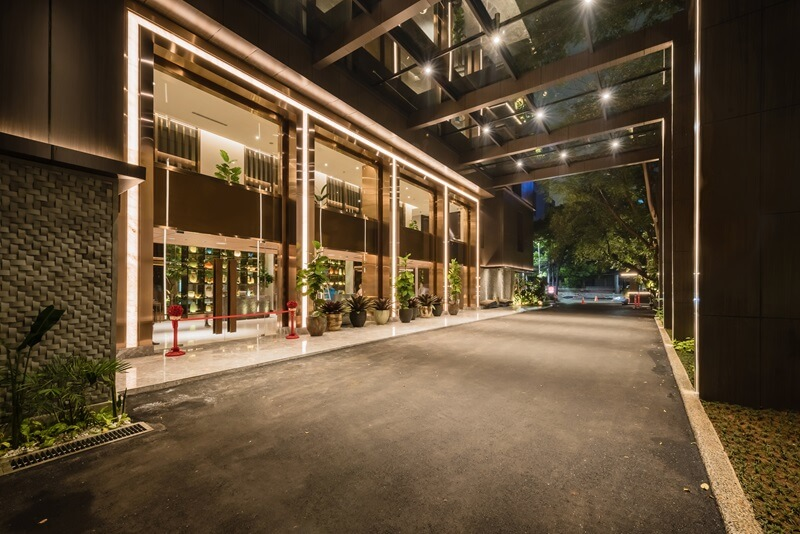 Luxury hotel entrance driveway lit at night