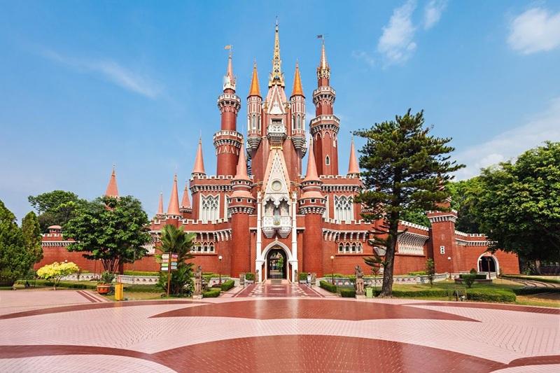 Red brick fairy tale castle with spires