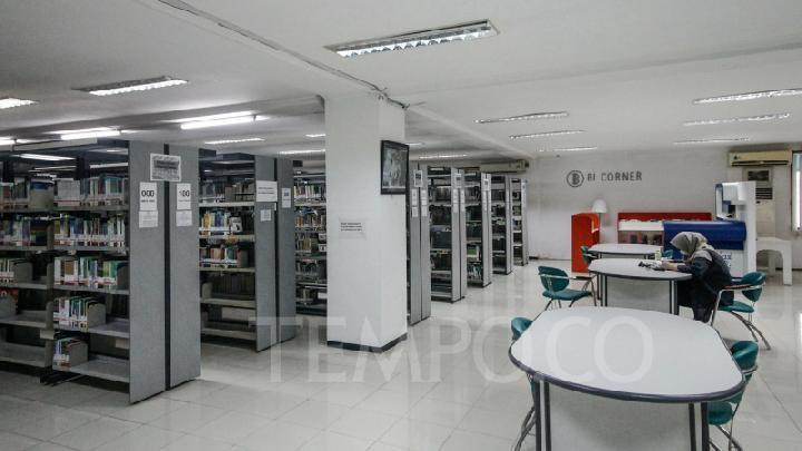 Quiet modern library reading area with bookshelves