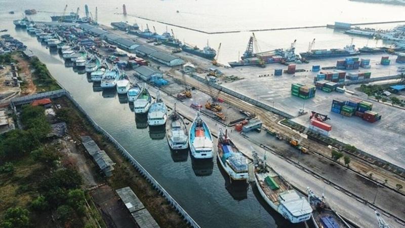 aerial view of cargo ships docked at busy port