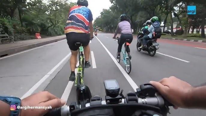 POV cycling with group on city road