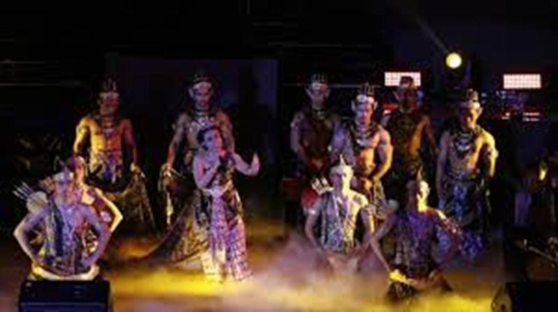 stage performance with traditional dancers in tribal costumes