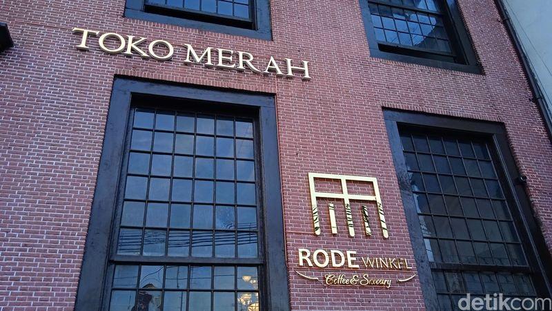 Toko Merah logo on red brick building