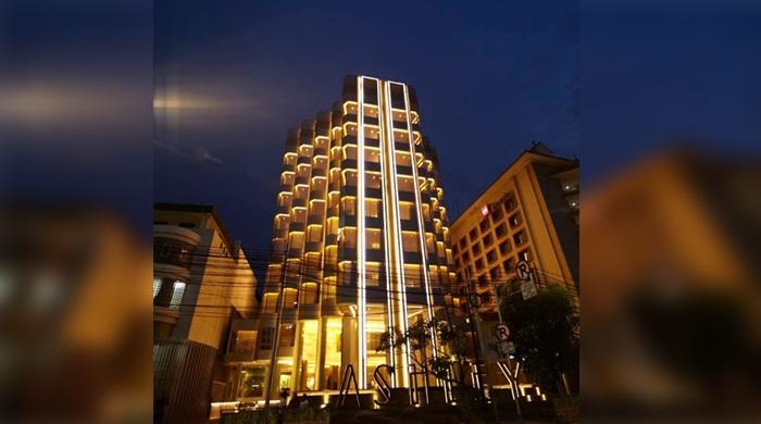 Illuminated modern hotel building at night