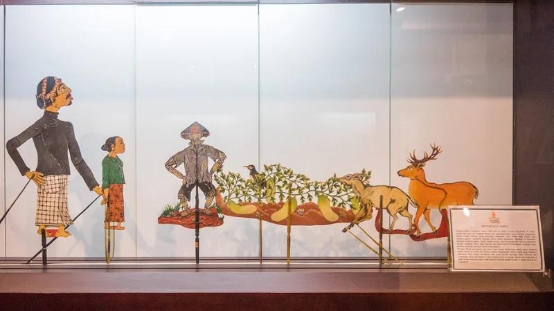 Wayang kulit shadow puppet display in glass case