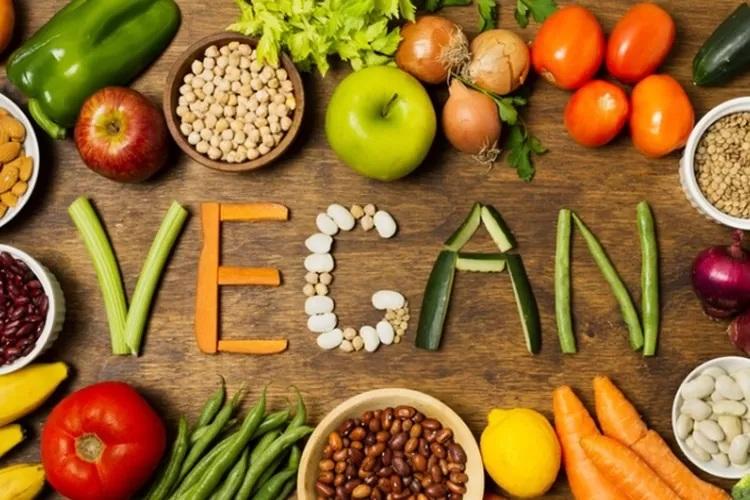 Vegan logo made from vegetables and legumes