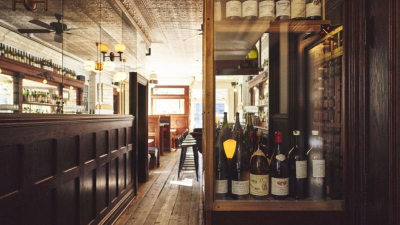 Vintage bar interior with wine bottles display