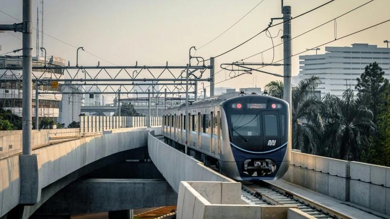 commuter train on elevated concrete tracks