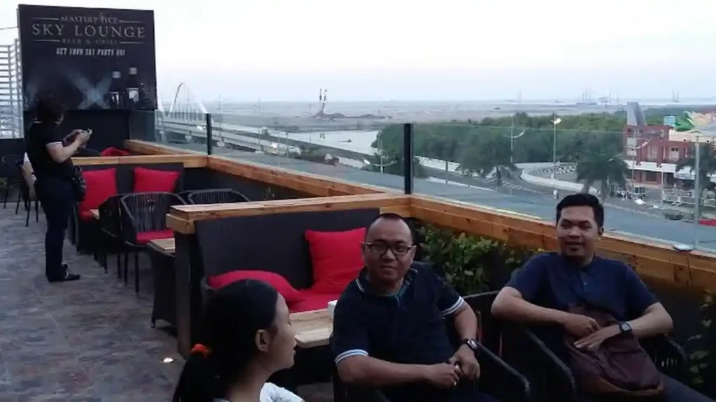 Masterpiece Sky Lounge logo and guests at Pantai Indah Kapuk