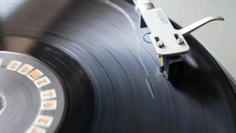 Vinyl record and tonearm close-up