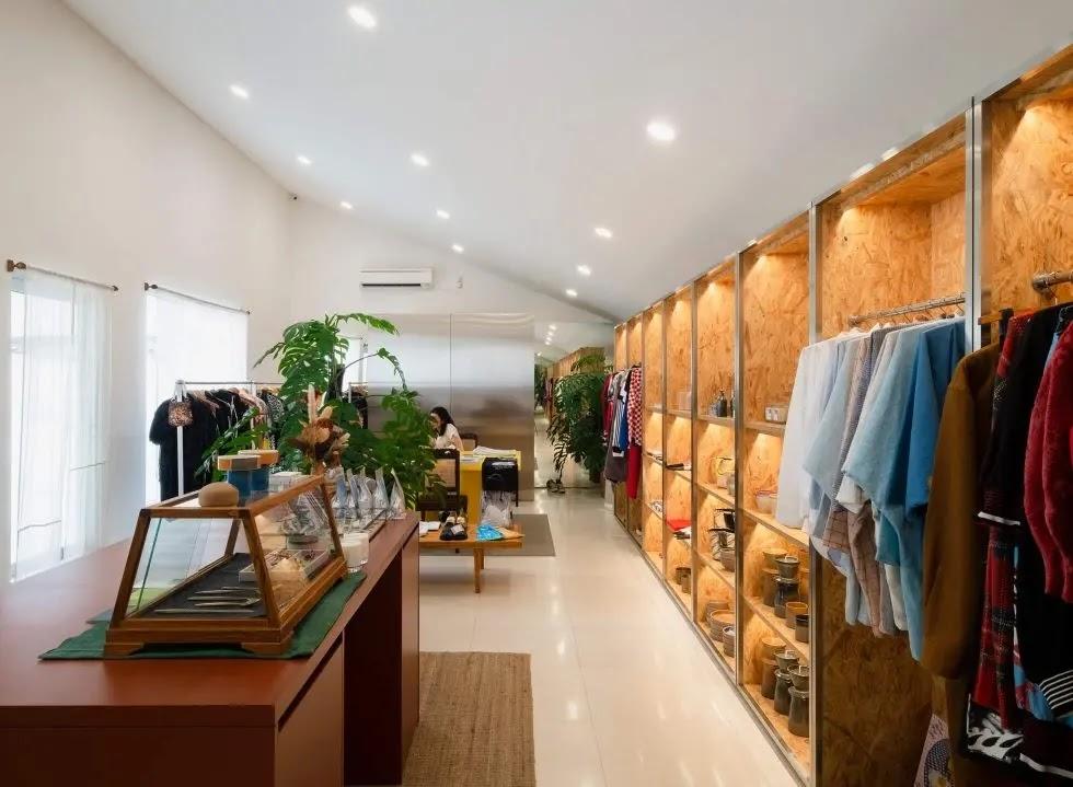 Bright modern boutique interior with clothing racks
