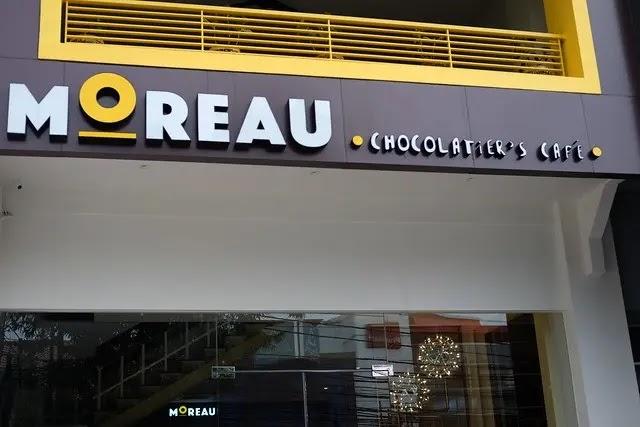 MOREAU chocolatier's cafe storefront logo sign