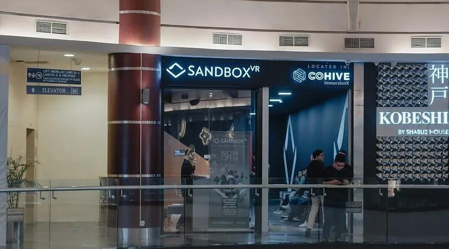 Sandbox VR logo on storefront in mall corridor