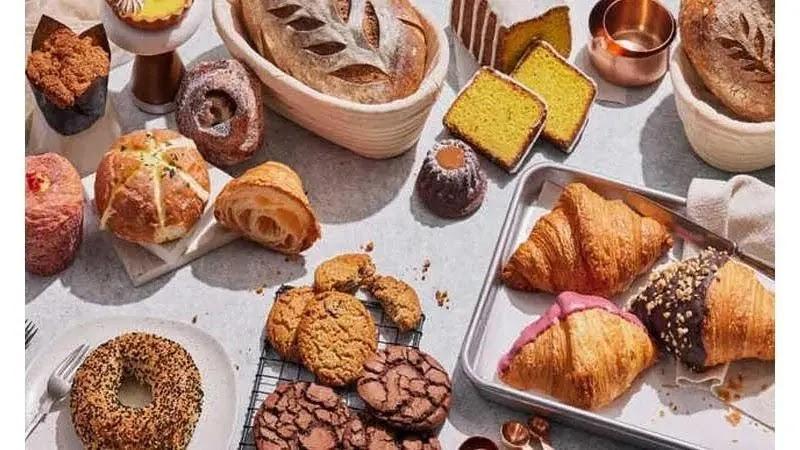 assorted bakery pastries and breads on table
