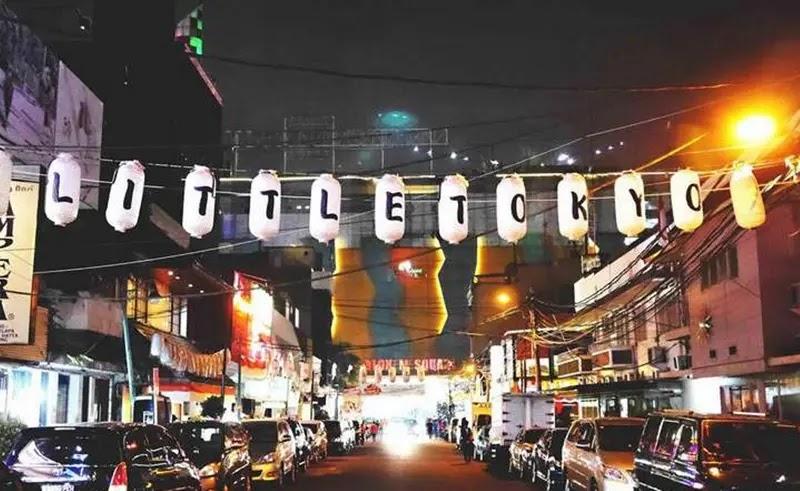 Little Tokyo lantern logo over nighttime street