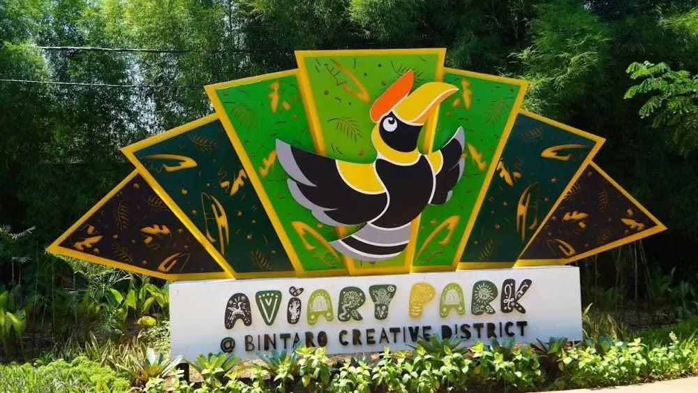 Aviary Park logo with colorful hornbill sign