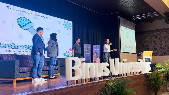 Panel presentation on stage at Binus University
