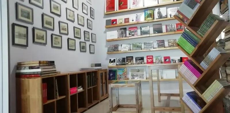 Cozy bookstore interior with wooden shelves and framed art