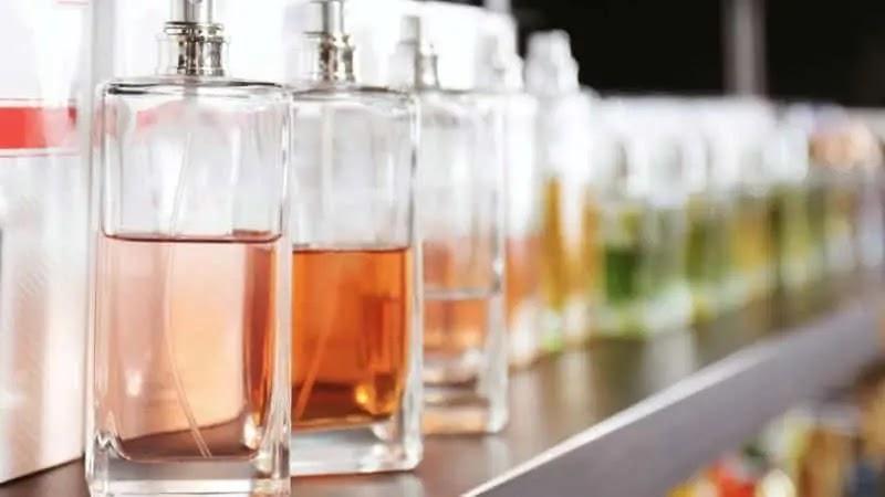 Glass perfume bottles with amber and green liquids