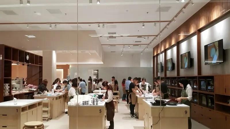 Busy retail workshop with customers at counters