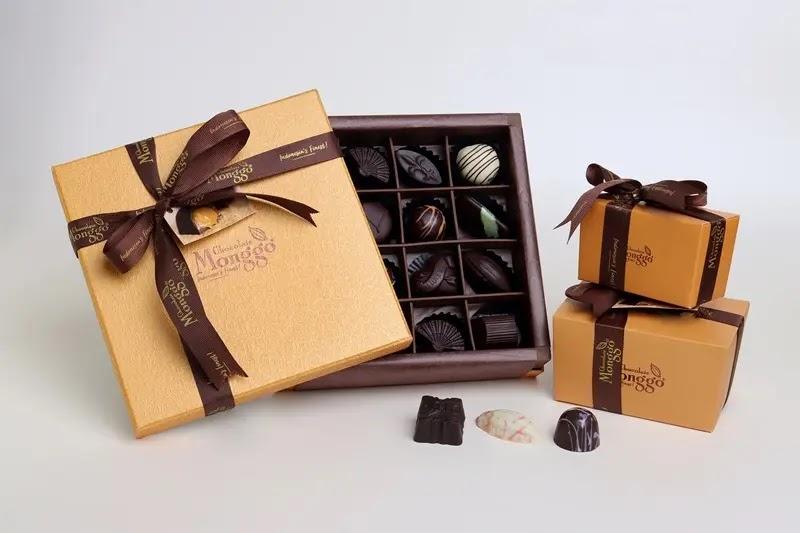 gold gift box and open chocolate box with ribbons