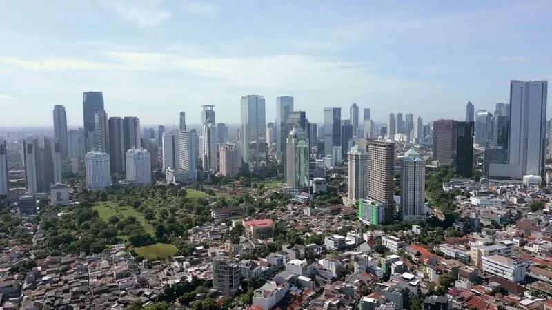 Aerial skyline of city with skyscrapers and homes