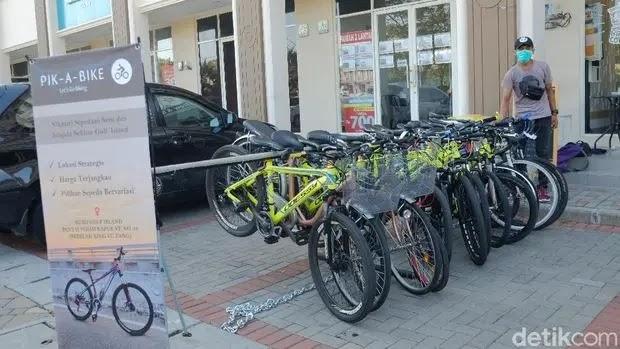 Pik-A-Bike rental bicycles lined up outside shop