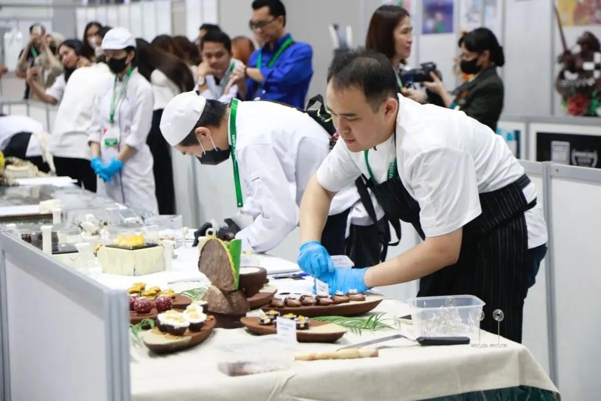 Pastry chefs preparing desserts at culinary competition