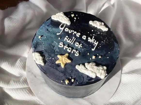Galaxy-themed cake with text You're a sky full of stars