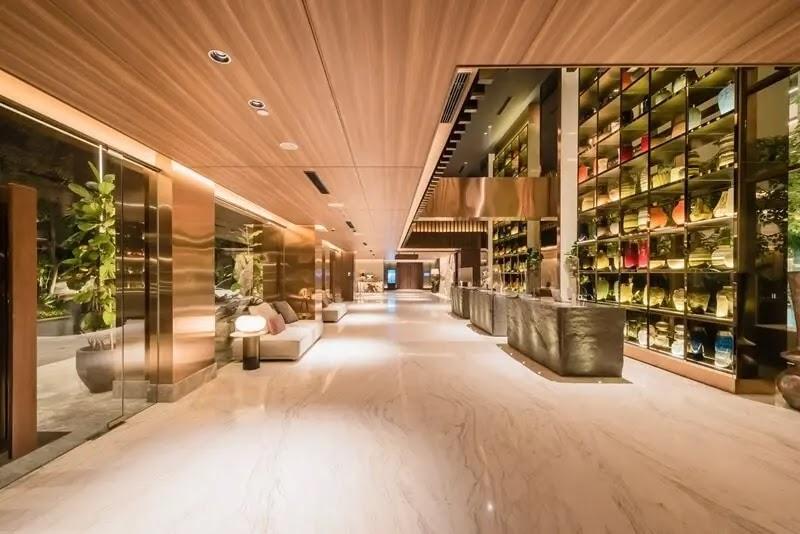 luxury hotel lobby with reception and display shelves