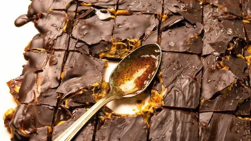 chocolate caramel squares with spoon