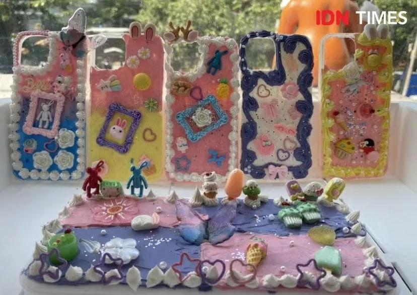 Pastel decorated phone cases and miniature cake scene