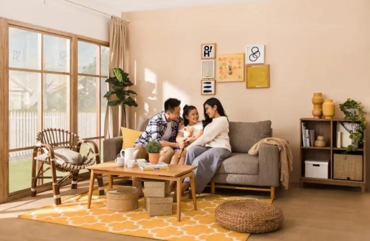 family on sofa in yellow-themed living room