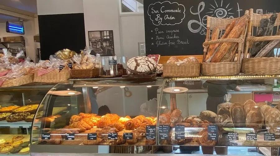 bakery display case with breads and pastries