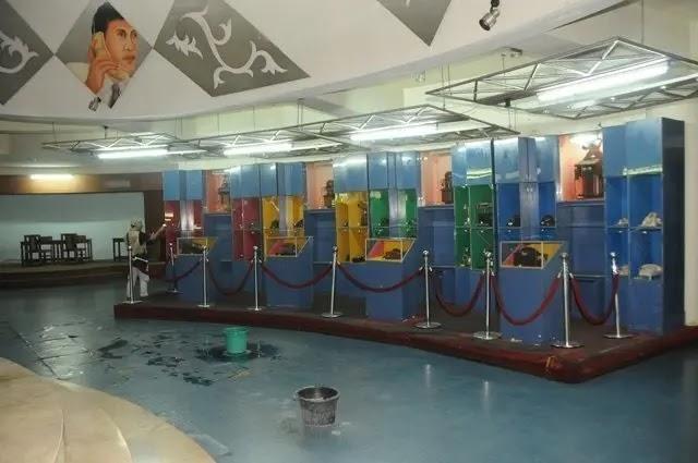 Museum exhibit with display cases in bright colors