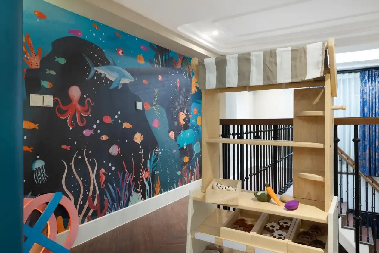 kids play market stall in room with ocean mural