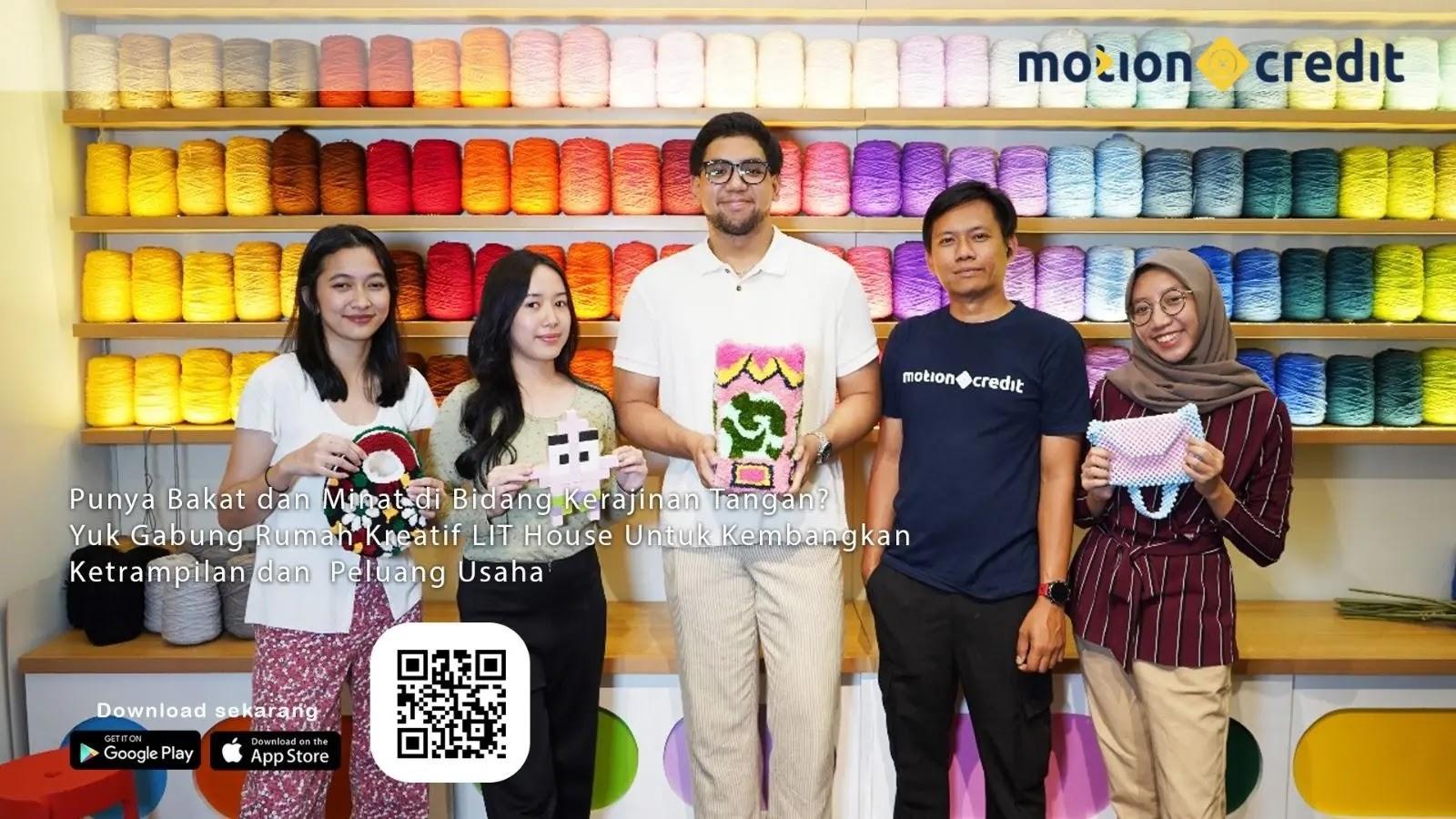 Five people in a colorful yarn shop holding handmade crafts