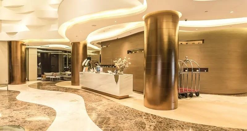 Luxury hotel lobby with marble floor and reception